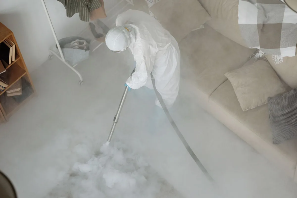 Biohazard cleanup technician in protective equipment, North Bay Village, FL